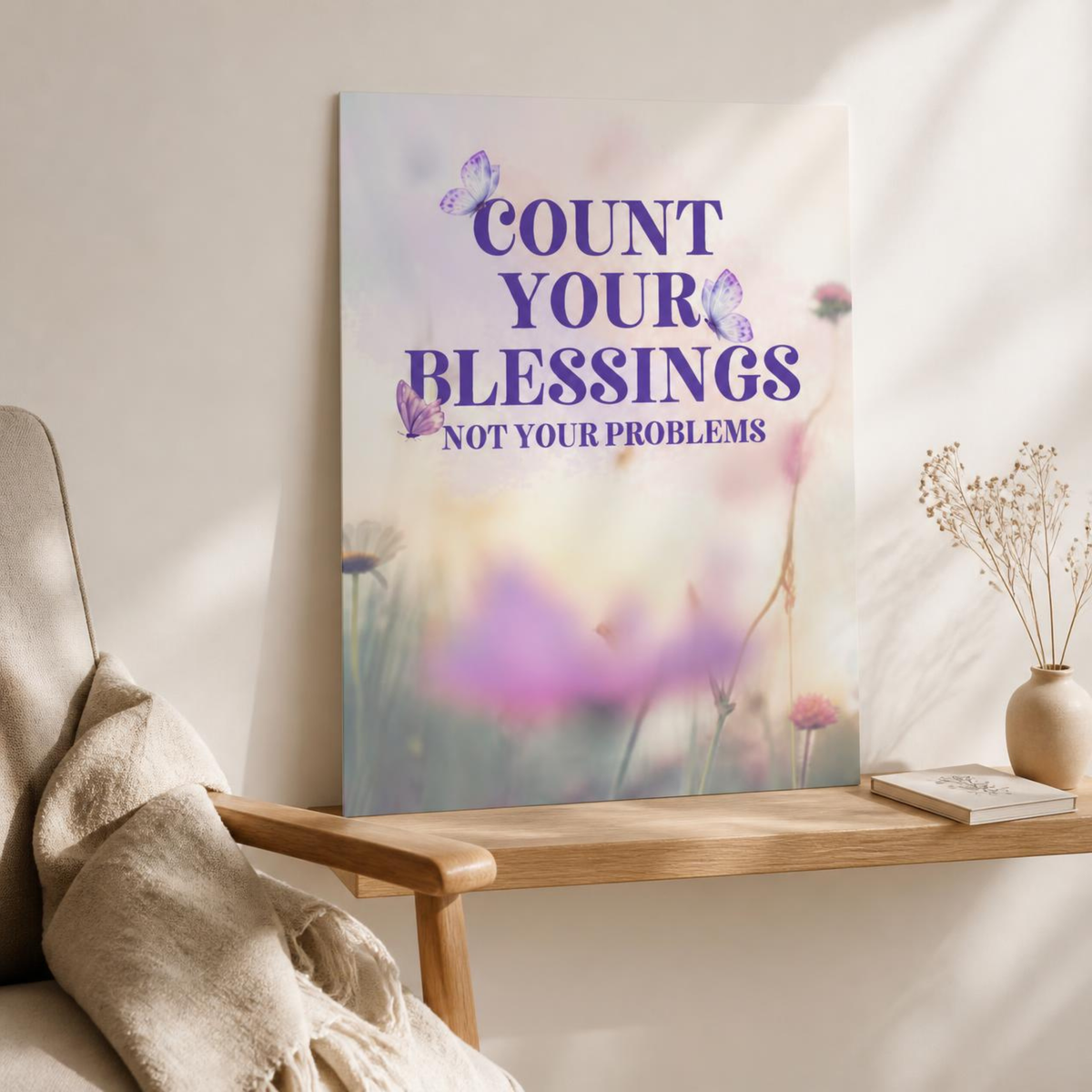 Unframed Count Your Blessings floral poster leaning on a wooden console beside an armchair and vase