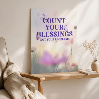 Unframed Count Your Blessings floral poster leaning on a wooden console beside an armchair and vase